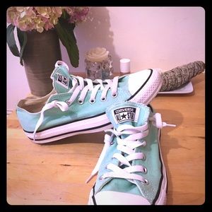 Converse low top teal Chuck Taylor.